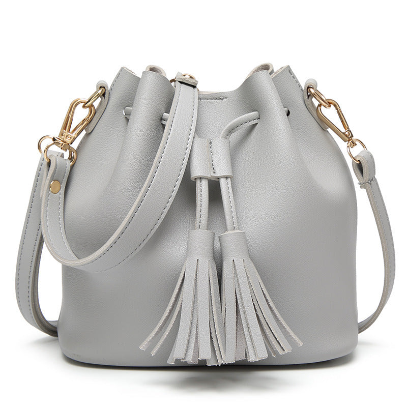 MS new Korean fashion shoulder belt buckle tassel satchel draw a bag on behalf of